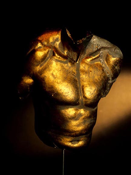 Ceramic torso with gold and pewter glaze 55 x 40cm with metal stand.